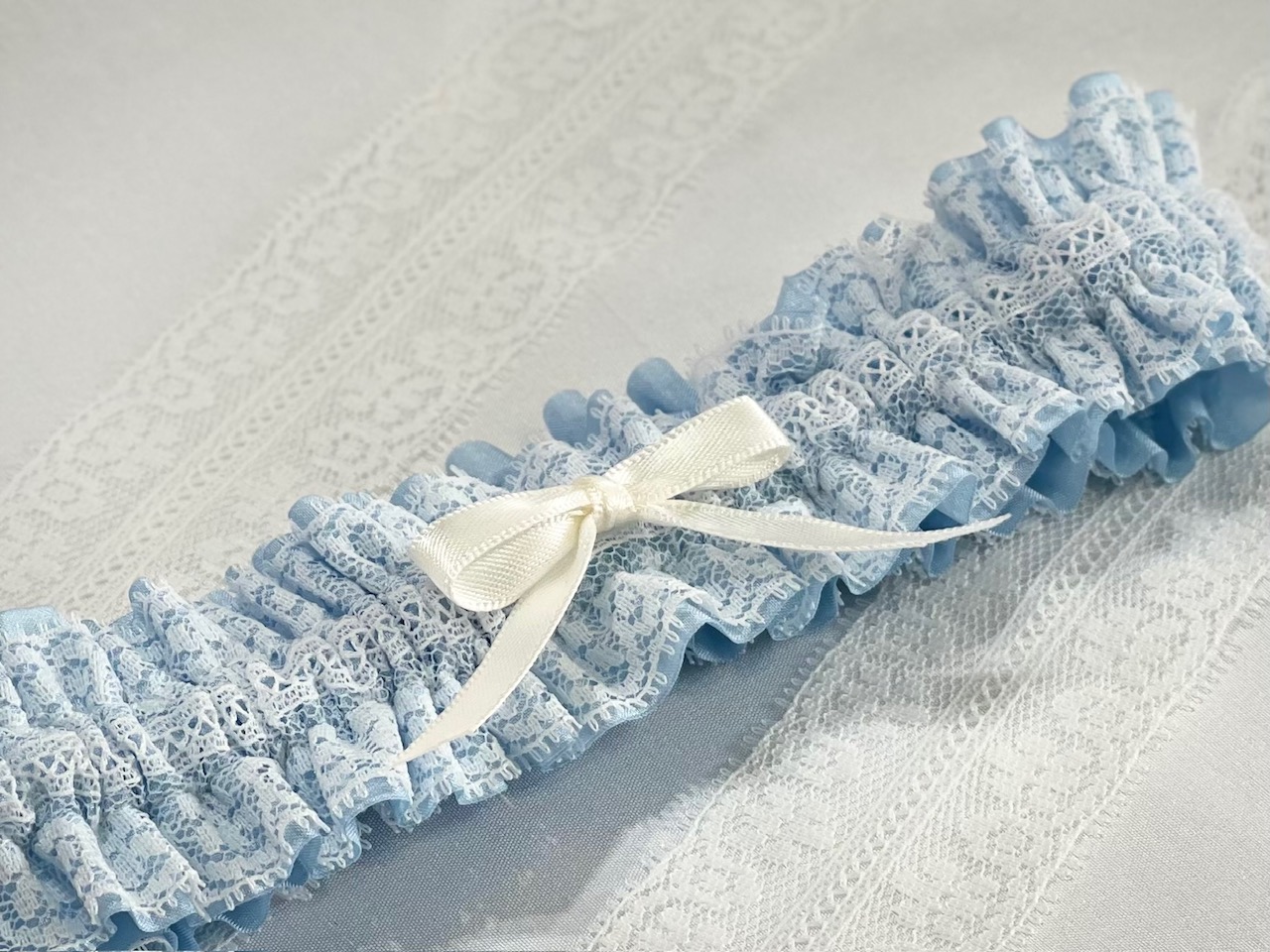 Delicate antique white lace garter with bow